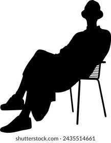 silhouette man sitting on armchair