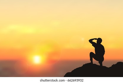 Silhouette of man sitting on Mountain cliff looking at sunset sky background