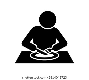 Silhouette of a man sitting at a table with a plate of food