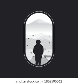 die Silhouette eines Mannes, der am Fluss steht und auf die schönen Berge blickt
