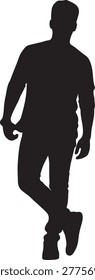 Silhouette of a man standing with hands in pockets