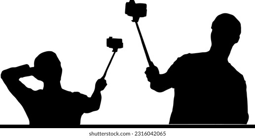 Silhouette of a man taking a selfie with a camera on a selfie stand, Capturing the moment Man's silhouette taking a selfie with a camera on a stand