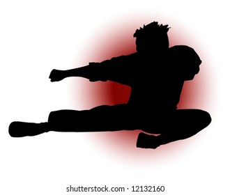 Silhouette of a man throwing a flying kick