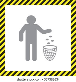 Silhouette of a man, throwing garbage in a bin