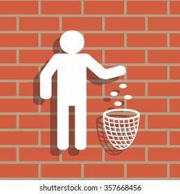 Silhouette of a man, throwing garbage in a bin