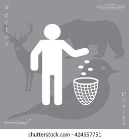 Silhouette of a man, throwing garbage in a bin