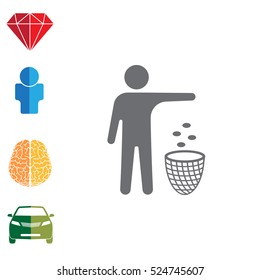 Silhouette of a man, throwing garbage in a bin