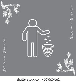 Silhouette of a man throwing garbage in a bin