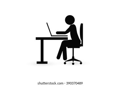 silhouette of a man typing at a laptop