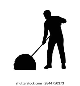 Silhouette of a man using a push mower to cut grass in a yard, emphasizing outdoor maintenance and landscaping activities.