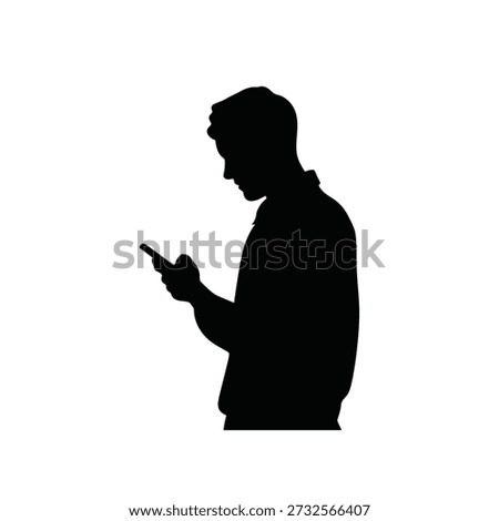 Silhouette of a man using a smartphone focused on modern communication
