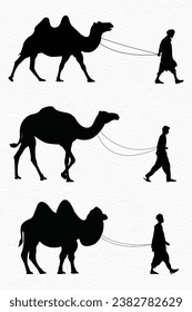 Silhouette of a man walking with camel