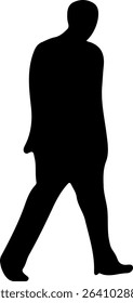 Silhouette of a man walking with his head bowed.