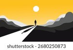 Silhouette of a man walking on a path towards the sun in a mountain landscape