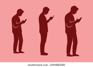 Silueta del hombre que camina mientras que mira abajo en su teléfono celular