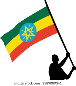 silhouette man waving Ethiopian flag high. High quality Vector illustration.