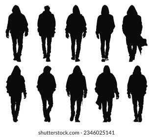 silhouette of man wearing hoodie walking