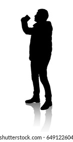 Silhouette of a man who drinks from a mug.