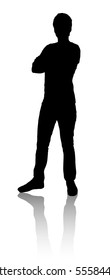 Silhouette of a man who stands. The man crossed his arms. Profile