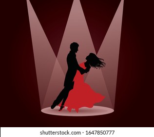 Silhouette Of A Man And A Woman Dancing In The Spot Light.