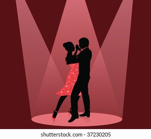 Silhouette Of A Man And A Woman Dancing In The Spot Light.