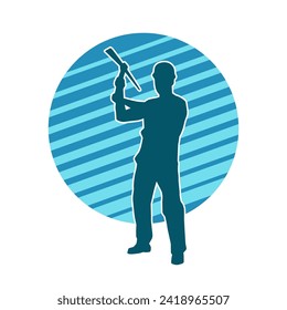 Silhouette of a man in worker costume carrying pick axe tool in action pose. Silhouette of a miner in action pose with pick axe tool.