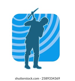 Silhouette of a man in worker costume carrying pick axe tool in action pose. Silhouette of a miner in action pose with pick axe tool.