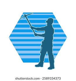 Silhouette of a man in worker costume carrying pick axe tool in action pose. Silhouette of a miner in action pose with pick axe tool.