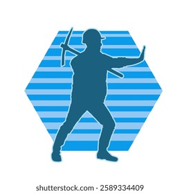 Silhouette of a man in worker costume carrying pick axe tool in action pose. Silhouette of a miner in action pose with pick axe tool.