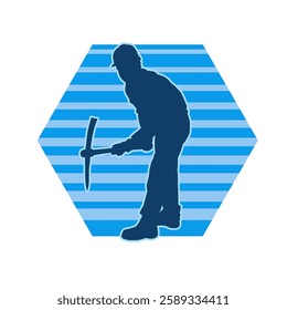 Silhouette of a man in worker costume carrying pick axe tool in action pose. Silhouette of a miner in action pose with pick axe tool.