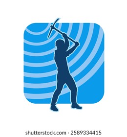 Silhouette of a man in worker costume carrying pick axe tool in action pose. Silhouette of a miner in action pose with pick axe tool.