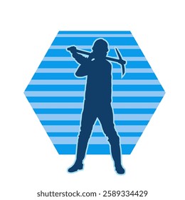 Silhouette of a man in worker costume carrying pick axe tool in action pose. Silhouette of a miner in action pose with pick axe tool.