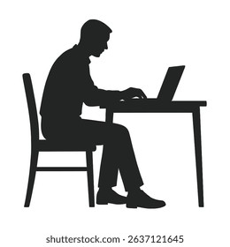 Silhouette of a man working on a laptop computer at a desk