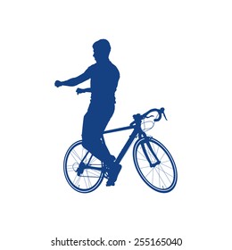 Silhouette of a man wrong sitting on the bicycle