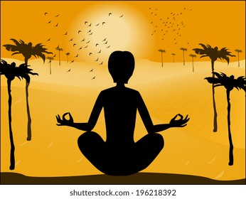 Silhouette of man in yoga pose on the background of the deser