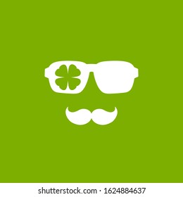 Silhouette of man's head in hipster glasses and irish clover. Green avatar with leaf. St Patrick avatar. Eco friendly. Isolated on white. Vector flat illustration.