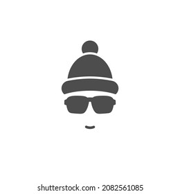 Silhouette of man's head with  hipster sun glasses and winter hat with pompon. Black skier holiday avatar with bobble hat.  Isolated on white. Vector flat illustration.