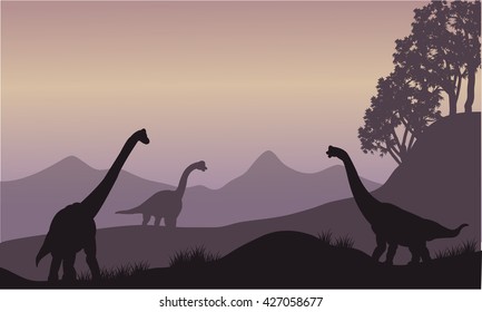 Silhouette of many Brachiosaurus in the hills