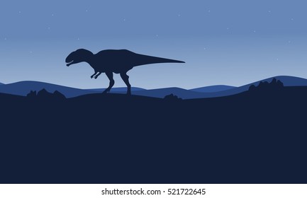 Silhouette of mapusaurus on desert scenery