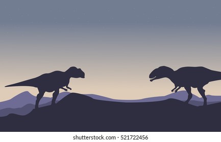 Silhouette of mapusaurus on the hill scenery