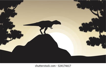 Silhouette of mapusaurus at sunrise