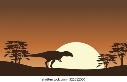 Silhouette of mapusaurus with tree scenery