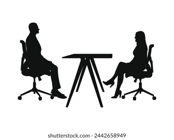 silhouette meeting businessman. male and female. sitting. facing.