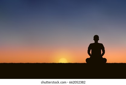 Silhouette of men sitting and meditating on the beach under sunset sky background