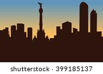 silhouette of mexico city and monument at sunset