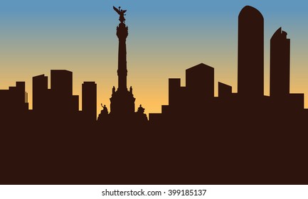 silhouette of mexico city and monument at sunset