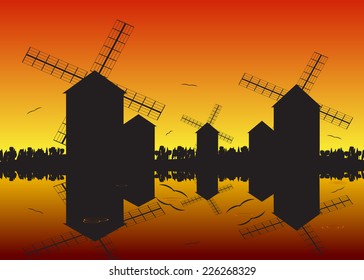 A silhouette of mills against a red decline