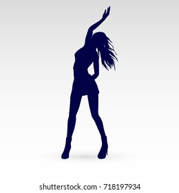 Silhouette of a Modern Dancer Poses in Front of the Gray
