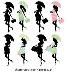 Silhouette moms to be under umbrellas