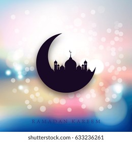 Silhouette of a mosque with a crescent on a light background with glare. The perfect backdrop for greetings Ramadan Kareem.